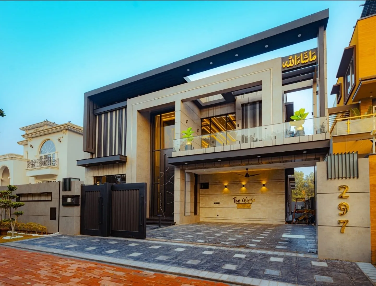 Angled front view showing the house entrance and upper balcony.