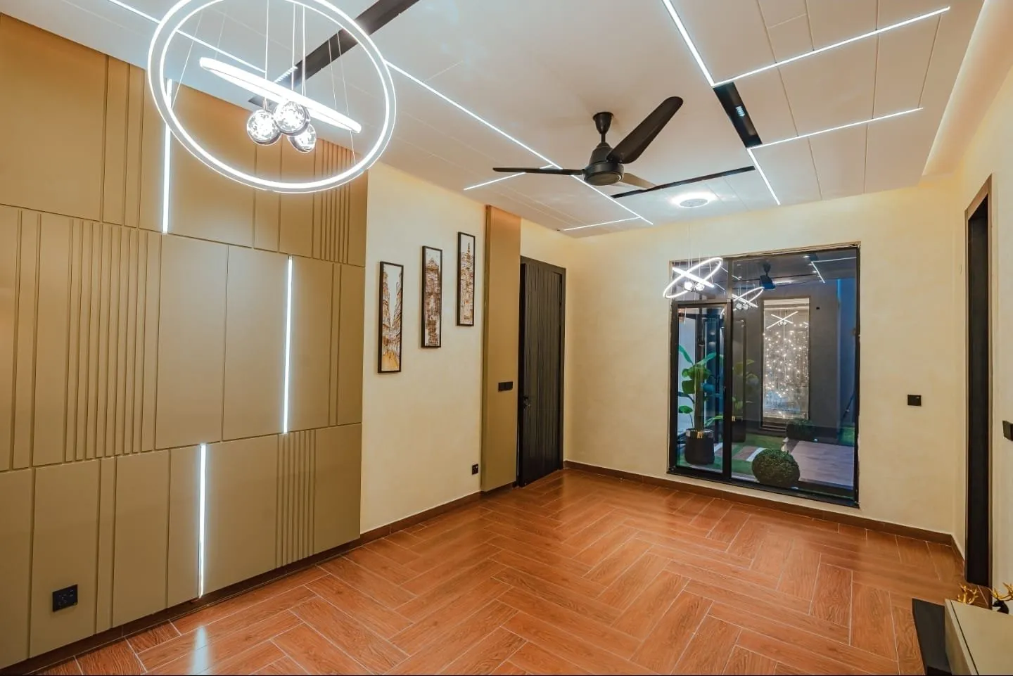 Room with fitted wardrobes and wood-look flooring.