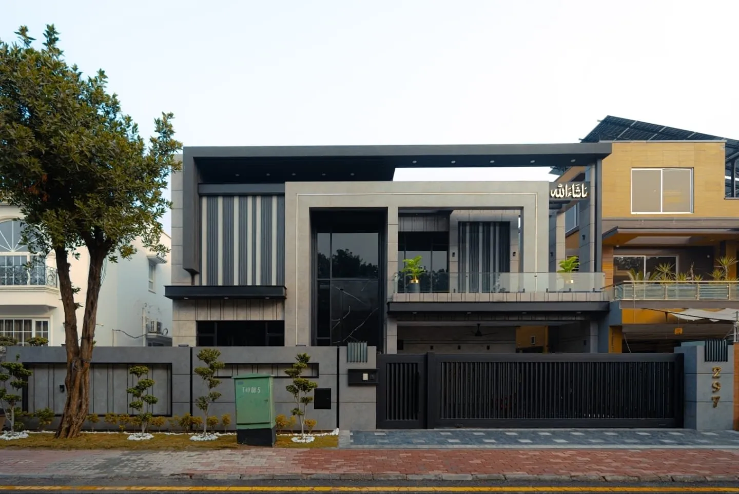 Daylight front view of the 1 kanal house in Overseas B Extension, Bahria Town Lahore.