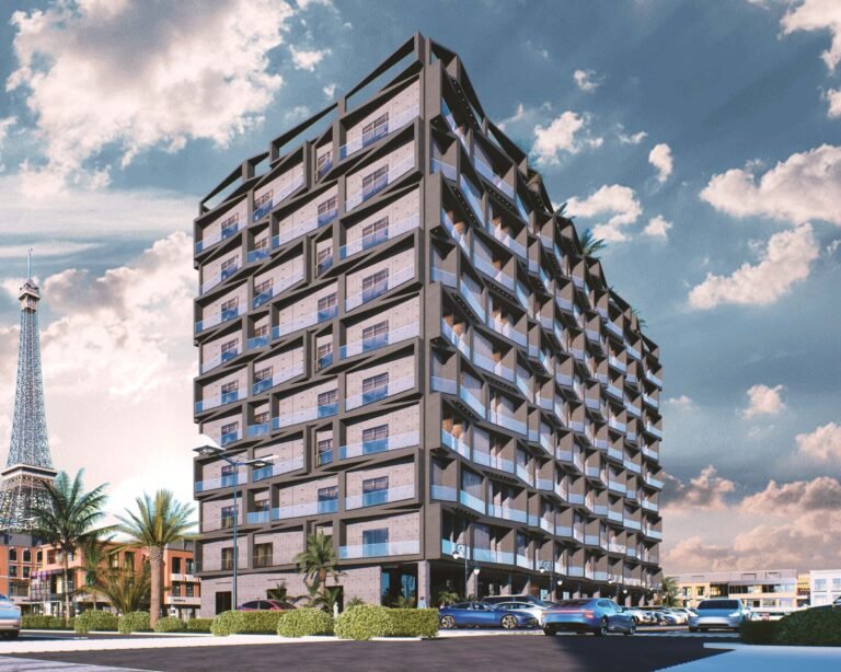 Side view of The Oasis Grand 14 building showing the signature inventory apartments with the Bahria Eiffel Tower visible in the background.